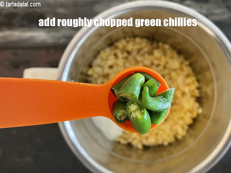 Step 13 – Add 4&nbsp;<a href="glossary-chopped-green-chilli-820i">green chillies , roughly chopped</a>.
