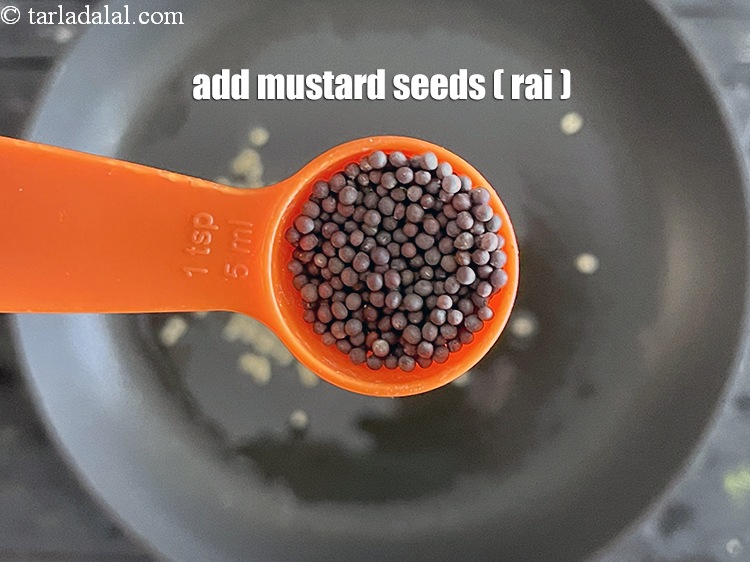 Step 48 – Add&nbsp;<meta charset="UTF-8" />1 tsp&nbsp;<a href="glossary-mustard-seeds-sarson-rai-sarson-ke-beej-525i">mustard seeds ( rai / sarson)</a>.