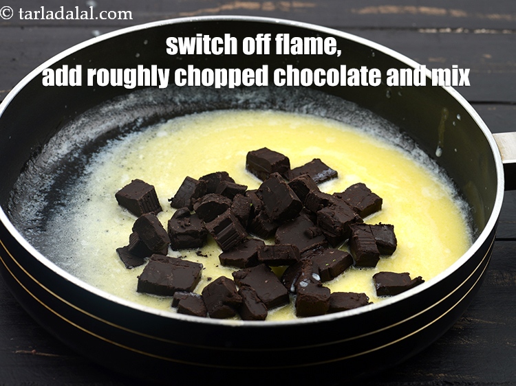 Step 5 – Switch off the flame, and add roughly&nbsp;<a href="https://www.tarladalal.com/glossary-chopped-dark-chocolate-792i">chopped dark chocolate</a> and mix very well using …