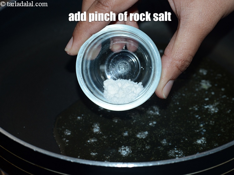 Step 7 – Add &frac34; cup <a href="https://www.tarladalal.com/glossary-rock-salt-sendha-namak-1644i">rock salt (sendha namak)</a>.&nbsp;