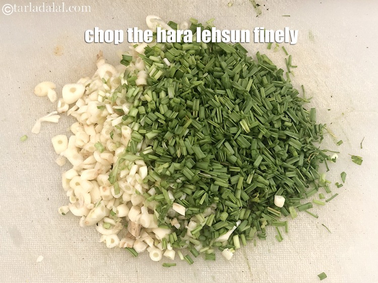 Step 7 – <meta charset="UTF-8" />Place the hara lehsun on a chopping board and chop the&nbsp;hara lehsun&nbsp;finely using …