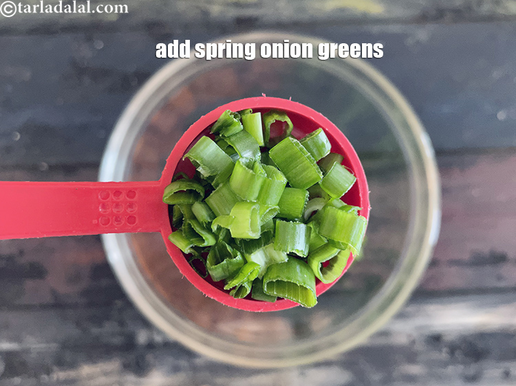 Step 6 – Add&nbsp;<meta charset="UTF-8" />2 tbsp&nbsp;finely&nbsp;<a href="glossary-chopped-spring-onion-greens-1030i">chopped spring onion greens</a>.