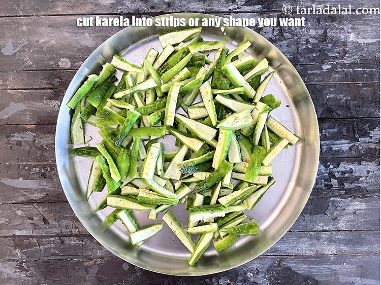 Step 5 – Cut karela into long strips or any shape you want.