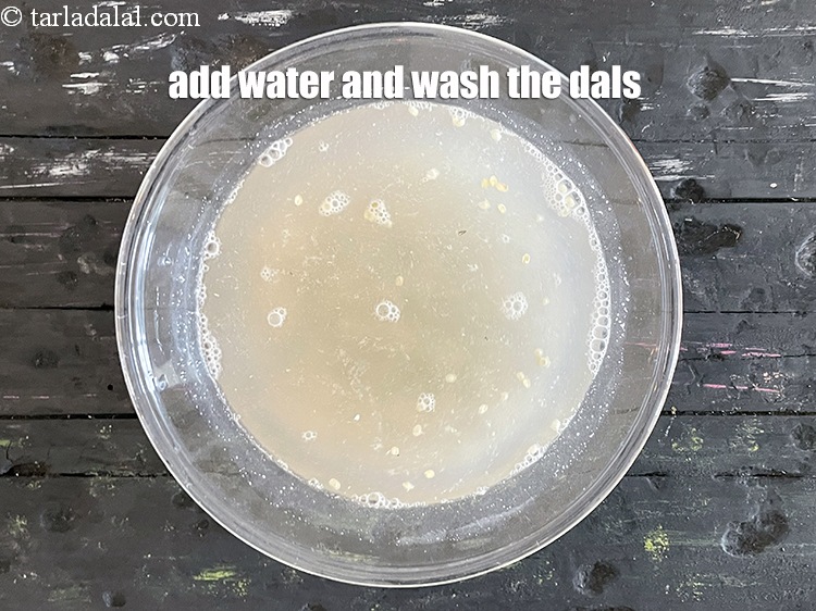 Step 5 – Add water and wash the dals.