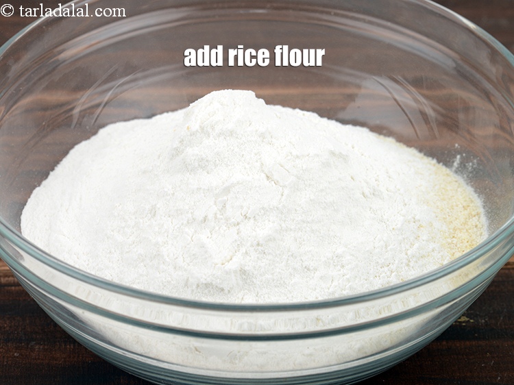 Step 5 – Add &frac14; cup <a href="https://www.tarladalal.com/glossary-rice-flour-chawal-ka-atta-534i">rice flour (chawal ka atta)</a>.
