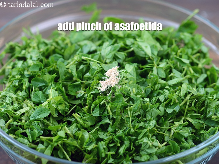 Step 5 – Add a pinch of <a href="https://www.tarladalal.com/glossary-asafoetida-hing-113i">asafoetida (hing)</a>.
