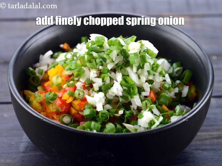 Step 5 – Add 1/4 cup finely&nbsp;<a href="https://www.tarladalal.com/glossary-chopped-spring-onions-1575i">chopped spring onion</a>&nbsp;( whites and greens).