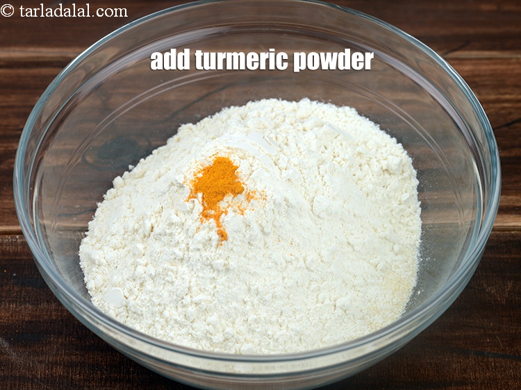 Step 8 – Add &frac14; tsp <a href="https://www.tarladalal.com/glossary-turmeric-powder-haldi-645i">turmeric powder (haldi)</a>.