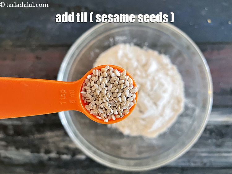 Step 9 – Add&nbsp;2 tsp&nbsp;<a href="glossary-sesame-seeds-til-gingelly-seeds-612i">sesame seeds (til)</a>.