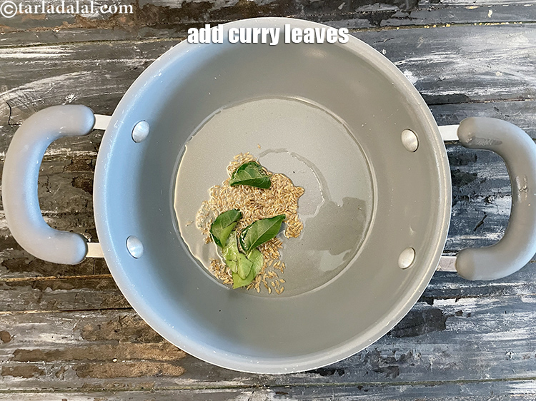 Step 11 – Add&nbsp;<meta charset="UTF-8" />5&nbsp;<a href="glossary-curry-leaves-kadi-patta-kadipatta-388i">curry leaves (kadi patta)</a>.