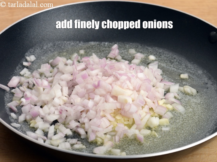 Step 8 – Add &frac12; cup finely <a href="https://www.tarladalal.com/glossary-chopped-onions-722i">chopped onions</a>.