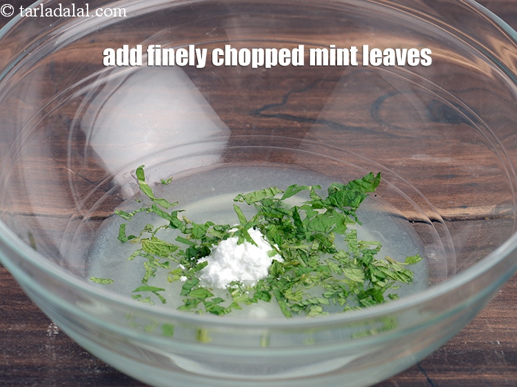 Step 5 – Add &frac12; tbsp finely <a href="https://www.tarladalal.com/glossary-chopped-mint-788i">chopped mint leaves (phudina)</a>.