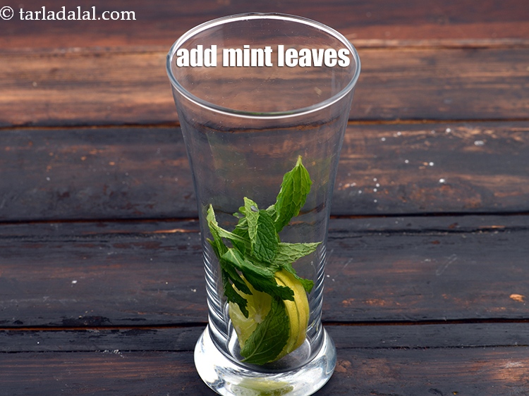 Step 5 – Add 10 <a href="https://www.tarladalal.com/glossary-mint-leaves-pudina-phudina-521i">mint leaves (pudina)</a>.