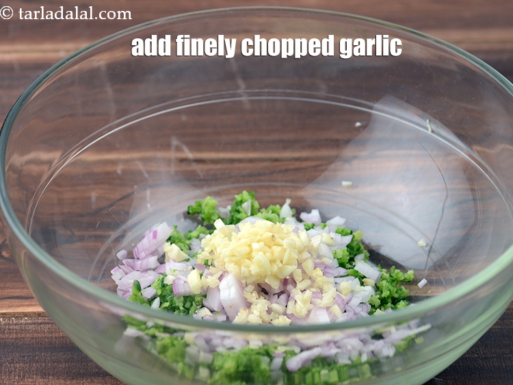 Step 5 – Add 1 1/2 tsp finely <a href="https://www.tarladalal.com/glossary-chopped-garlic-790i">chopped garlic (lehsun)</a>.