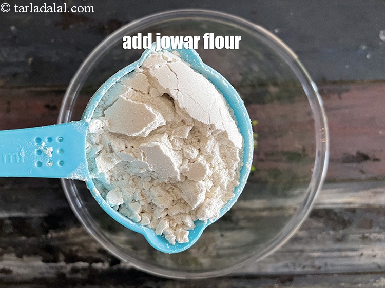 Step 7 – Add&nbsp;<meta charset="UTF-8" />1/2 cup&nbsp;<a href="glossary-jowar-flour-jowar-ka-atta-white-millet-flour-sorghum-flour-483i">jowar (white millet) flour</a>.