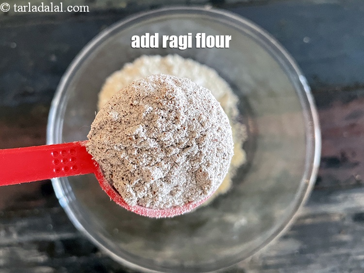 Step 7 – Add&nbsp;<meta charset="UTF-8" />5 tbsp&nbsp;<a href="glossary-ragi-flour-nachni-flour-nachni-ka-atta-red-millet-flour-1115i">ragi (nachni / red millet) flour</a>.