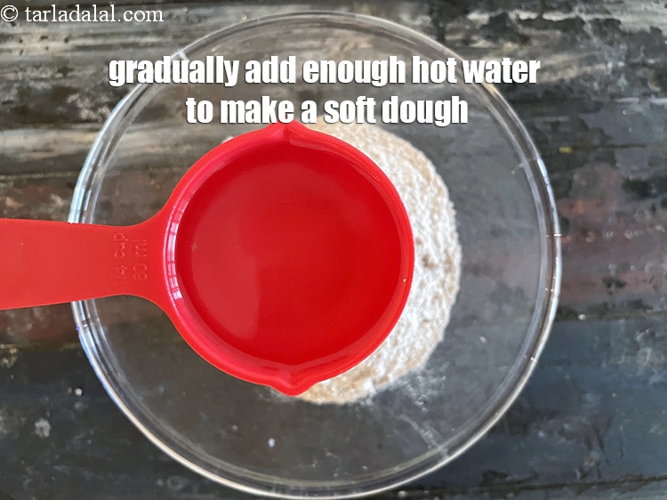 Step 12 – <meta charset="UTF-8" /> <u><em>Gradually add enough hot water to make a soft dough.&nbsp;</em></u>We added 1/2&nbsp;cup&nbsp;water …