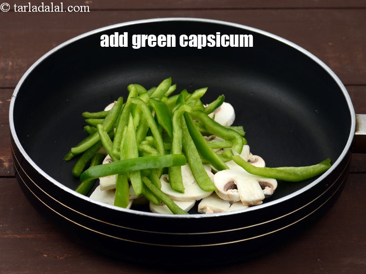 Step 13 – Add 1/2 cup&nbsp;<a href="https://www.tarladalal.com/glossary-sliced-capsicum-165i">sliced green capsicum</a>.