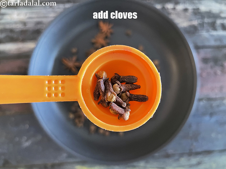 Step 9 – Add&nbsp;<meta charset="UTF-8" />12&nbsp;<a href="glossary-cloves-322i">cloves (laung / lavang)</a>.