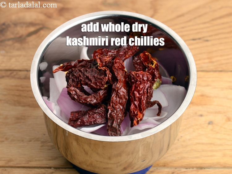 Step 6 – Add 7 <a href="https://www.tarladalal.com/glossary-whole-dry-kashmiri-red-chillies-kashmiri-mirch-kashmiri-lal-mirch-332i">whole dry kashmiri red chillies</a>&nbsp;, broken into pieces.