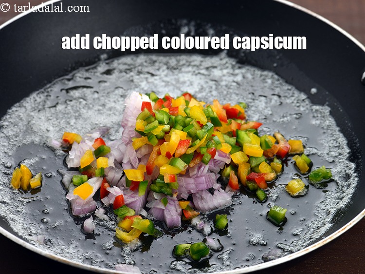 Step 5 – Add &frac14; cup <a href="https://www.tarladalal.com/glossary-chopped-capsicum-164i">chopped coloured capsicum</a>.