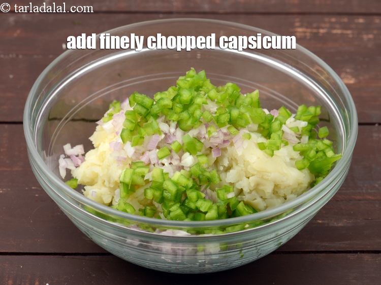 Step 5 – Add 1/4 cup&nbsp;finely&nbsp;<a href="https://tarladalal.com/glossary-chopped-capsicum-164i">chopped capsicum</a>.&nbsp;