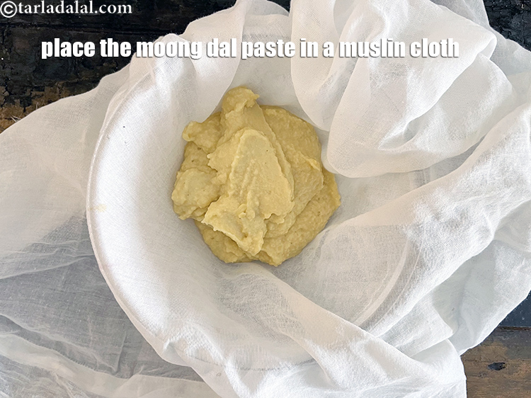 Step 12 – <meta charset="UTF-8" />Place the moong dal paste into the muslin cloth.