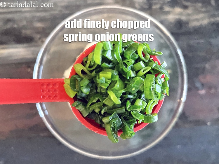 Step 13 – Add&nbsp;<meta charset="UTF-8" />1 tbsp&nbsp;finely&nbsp;<a href="glossary-chopped-spring-onion-greens-1030i">chopped spring onion greens</a>.