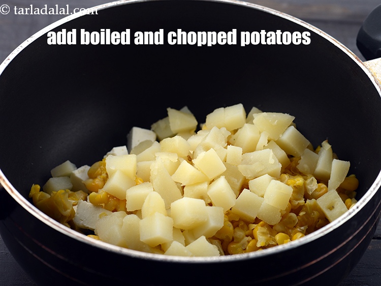 Step 5 – Add 1/2 cup&nbsp;<a href="https://www.tarladalal.com/glossary-boiled-and-chopped-potatoes-1879i">boiled , peeled and chopped potatoes</a>.