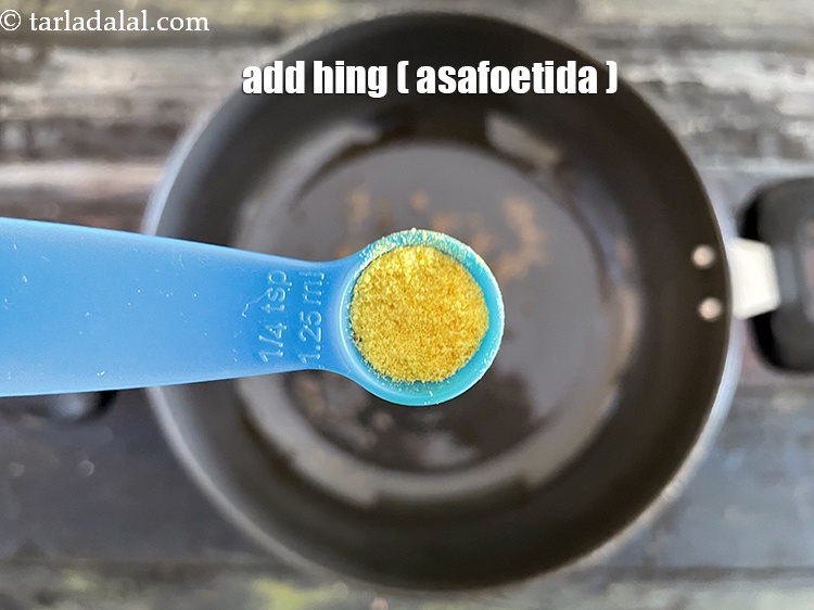 Step 21 – Add&nbsp;a pinch of&nbsp;<a href="https://tarladalal.com/glossary-asafoetida-hing-113i">asafoetida (hing)</a>.