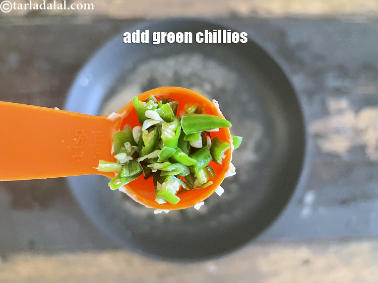 Step 22 – Add&nbsp;<meta charset="UTF-8" />1 tsp&nbsp;finely&nbsp;<a href="glossary-chopped-green-chilli-820i">chopped green chillies</a>.
