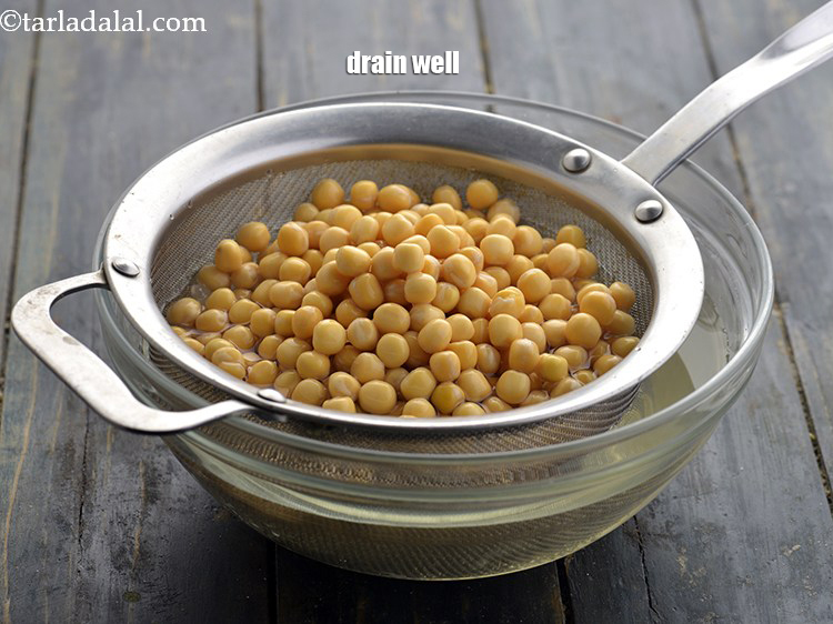 Step 16 – After 8 hours, drain the peas using a strainer and discard the water.