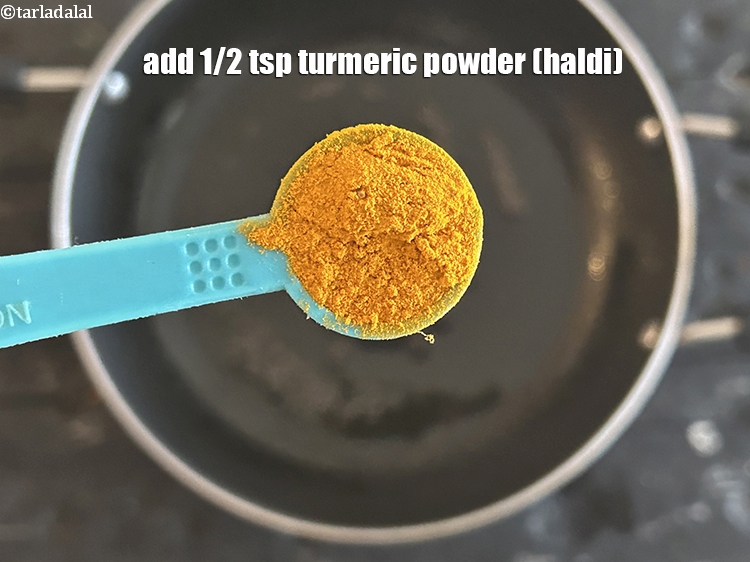 Step 7 – Add&nbsp;<meta charset="UTF-8" />1/2 tsp&nbsp;<a href="glossary-turmeric-powder-haldi-645i">turmeric powder (haldi)</a>.