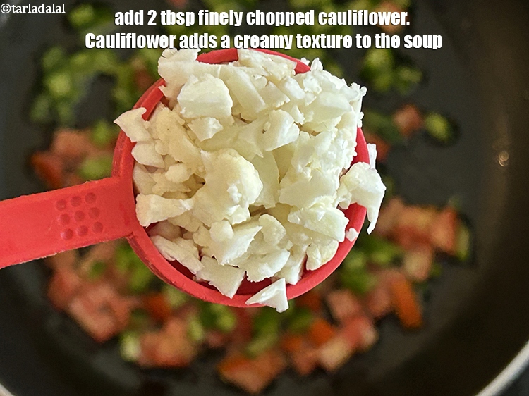 Step 11 – Add&nbsp;<meta charset="UTF-8" />2 tbsp&nbsp;finely&nbsp;<a href="glossary-chopped-cauliflower-796i">chopped cauliflower</a>.&nbsp;Cauliflower adds a creamy texture to the soup.