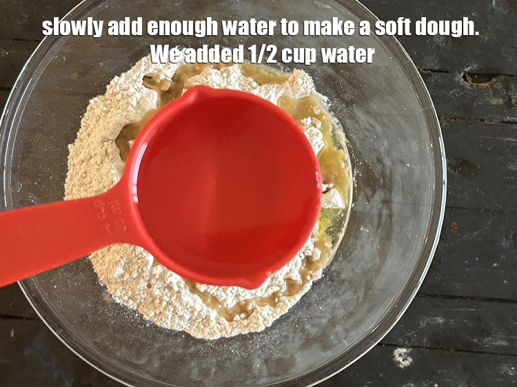 Step 6 – Slowly add enough water to make a soft dough. We added 1/2 cup water.