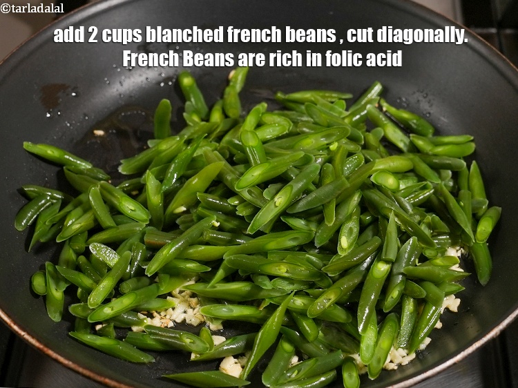 Step 25 – Add&nbsp;4 cups&nbsp;blanched&nbsp;<a href="glossary-french-beans-fansi-196i">french beans</a>&nbsp;, cut diagonally.&nbsp;<a href="https://www.tarladalal.com/recipes-using-french-beans-196">French Beans</a>&nbsp;are&nbsp;rich in&nbsp;<a href="https://www.tarladalal.com/recipes-for-Pregnancy-Folic-Acid-Rich-447" target="_blank">folic acid</a>. &nbsp;A deficiency of …