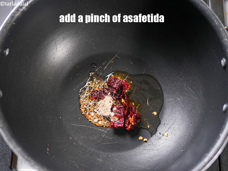 Step 6 – Add a pinch of asafetida.&nbsp;
