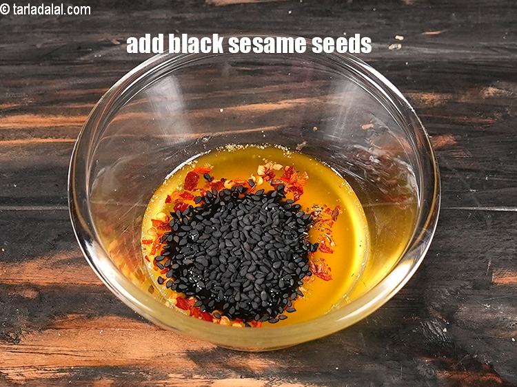 Step 9 – Add 1 tsp <a href="https://www.tarladalal.com/glossary-black-sesame-seeds-kala-til-kale-til-862i">black sesame seeds (kala til)</a>.