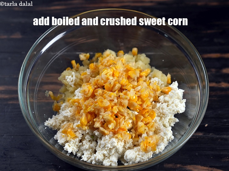 Step 6 – Add &frac14; cup boiled and coarsely <a href="https://www.tarladalal.com/glossary-crushed-sweet-corn-kernels-1605i">crushed sweet corn kernels (makai ke dane)</a>.