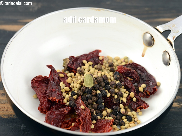 Step 7 – Add 1 <a href="https://www.tarladalal.com/glossary-cardamom-elaichi-262i">cardamom (elaichi)</a>.