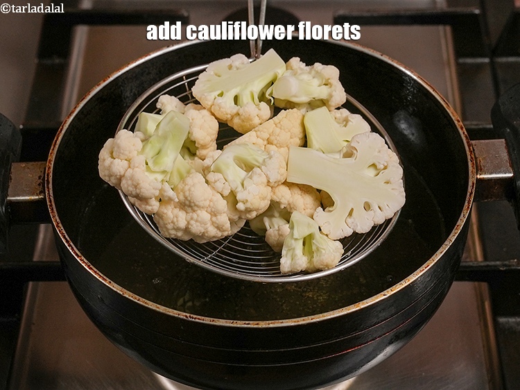 Step 6 – Add 1&frac12; cups of <a href="https://www.tarladalal.com/glossary-cauliflower-florets-753i">cauliflower florets</a>.