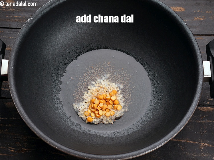 Step 6 – Add 1 tsp&nbsp;<a href="https://www.tarladalal.com/glossary-chana-dal-split-bengal-gram-285i">chana dal (split Bengal gram)</a>.&nbsp;