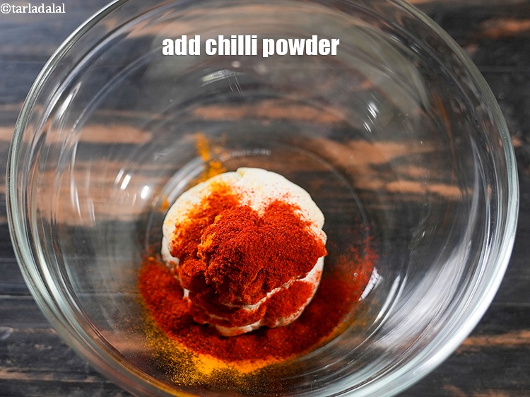 Step 6 – Add 1 tbsp <a href="https://www.tarladalal.com/glossary-chilli-powder-red-chilli-powder-339i">chilli powder</a>.&nbsp;