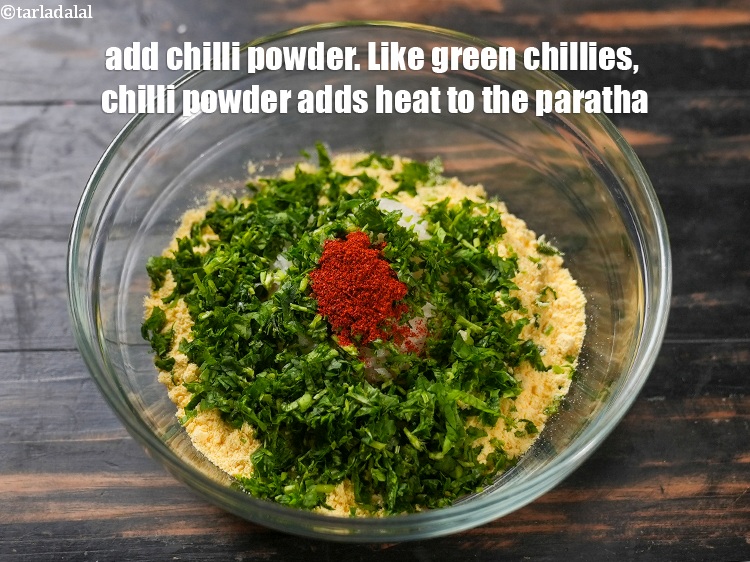 Step 6 – Add 1/2 tsp&nbsp;<a href="https://www.tarladalal.com/glossary-chilli-powder-red-chilli-powder-339i">chilli powder</a>. Like green chillies, chilli powder adds heat to the paratha.
