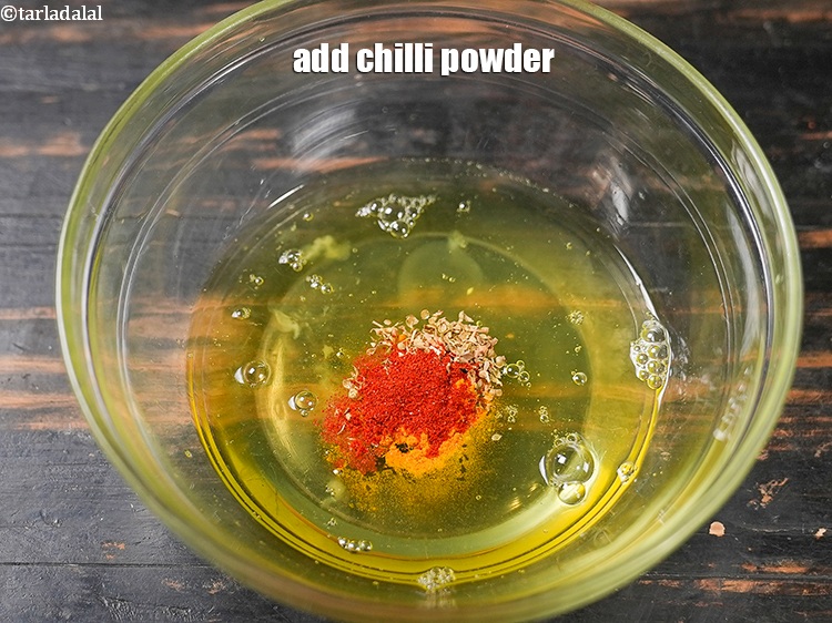 Step 6 – Add &frac12; tsp <a href="https://www.tarladalal.com/glossary-chilli-powder-red-chilli-powder-339i">chilli powder</a>.