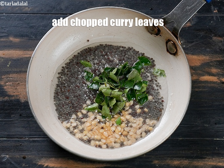 Step 6 – Add 1 tbsp <a href="https://www.tarladalal.com/glossary-chopped-curry-leaves-794i">chopped curry leaves (kadi patta)</a>.