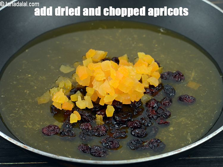 Step 7 – Add &frac14; cup dried and&nbsp;<a href="https://www.tarladalal.com/glossary-chopped-dried-apricots-845i">chopped apricots (kummani / jardalu)</a>.