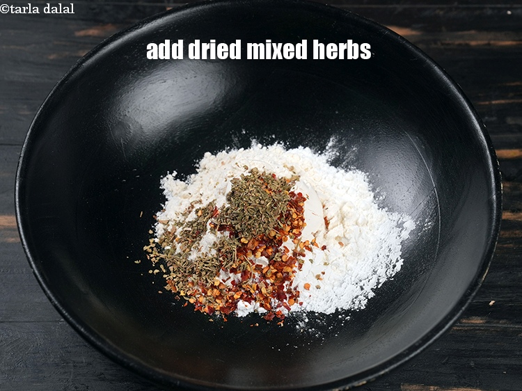 Step 6 – Add 1 tsp <a href="https://www.tarladalal.com/glossary-dried-mixed-herbs-466i">dried mixed herbs</a>.