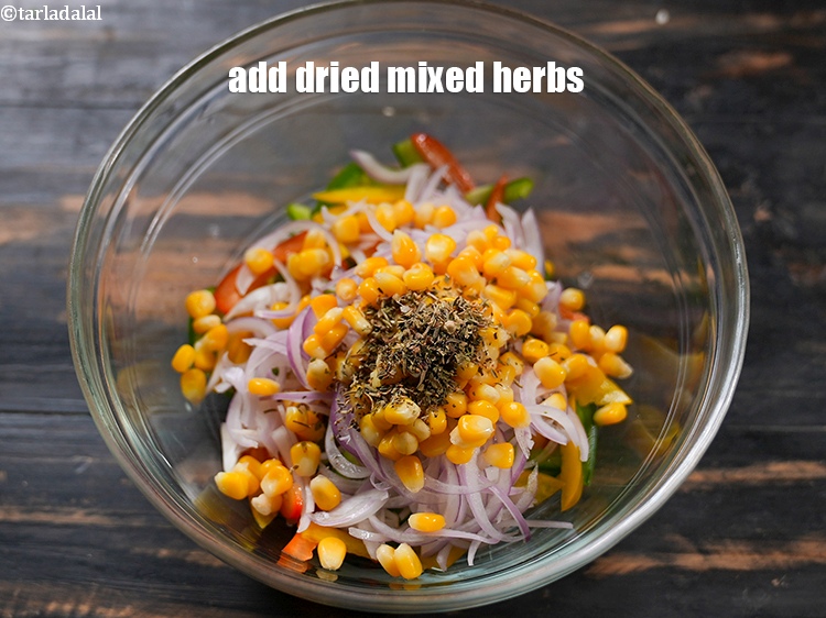 Step 6 – Add 1/2 tsp <a href="https://www.tarladalal.com/glossary-dried-mixed-herbs-466i">dried mixed herbs</a>.