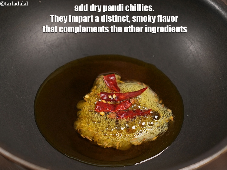 Step 6 – Add 2 dry <a href="https://www.tarladalal.com/glossary-pandi-chillies-pandi-dry-red-chillies-2373i">pandi chillies</a>. They impart a distinct, smoky flavor that complements the …